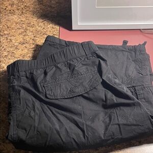 Men's Black Cargo Shorts has a little pallet dust on the pocket